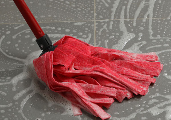 Mopping tile floor | Kay Riley Flooring and Design